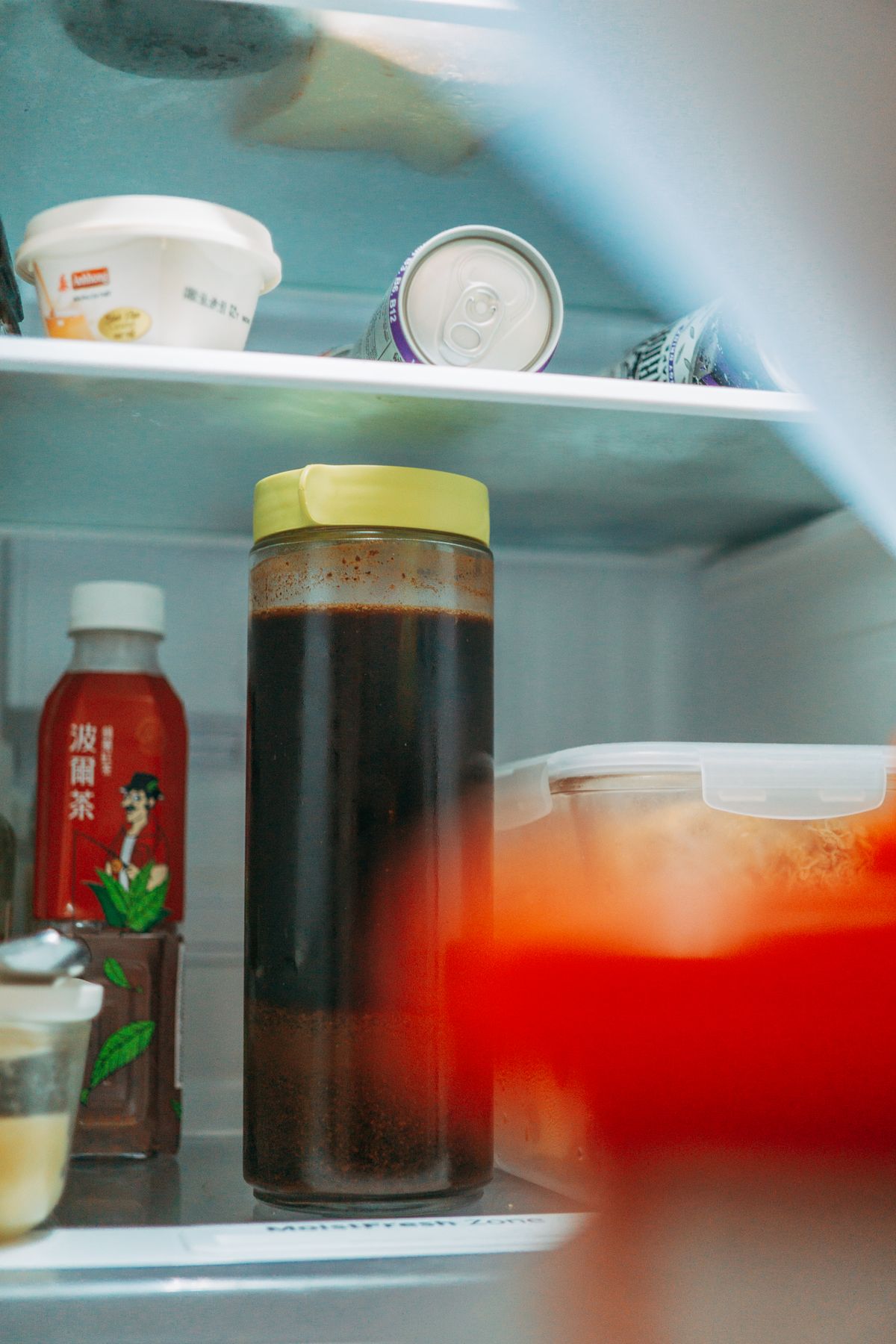 Food arranged on refrigerator shelves