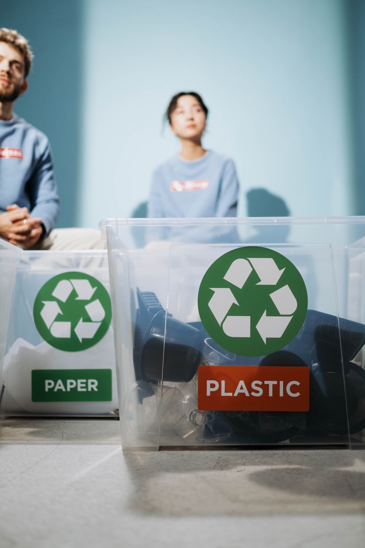 Labeled bins for paper and plastic