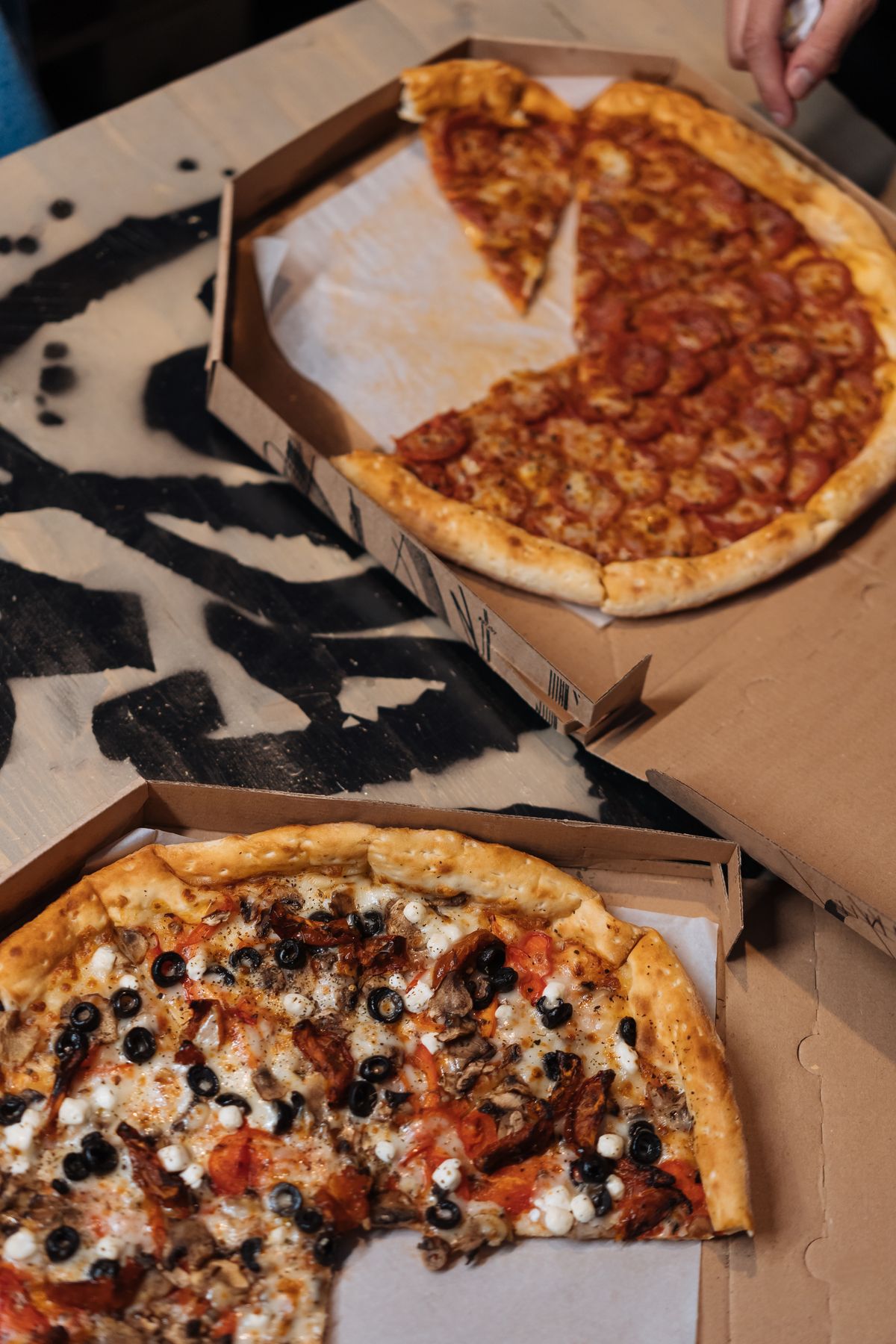 Pizza in open cardboard boxes
