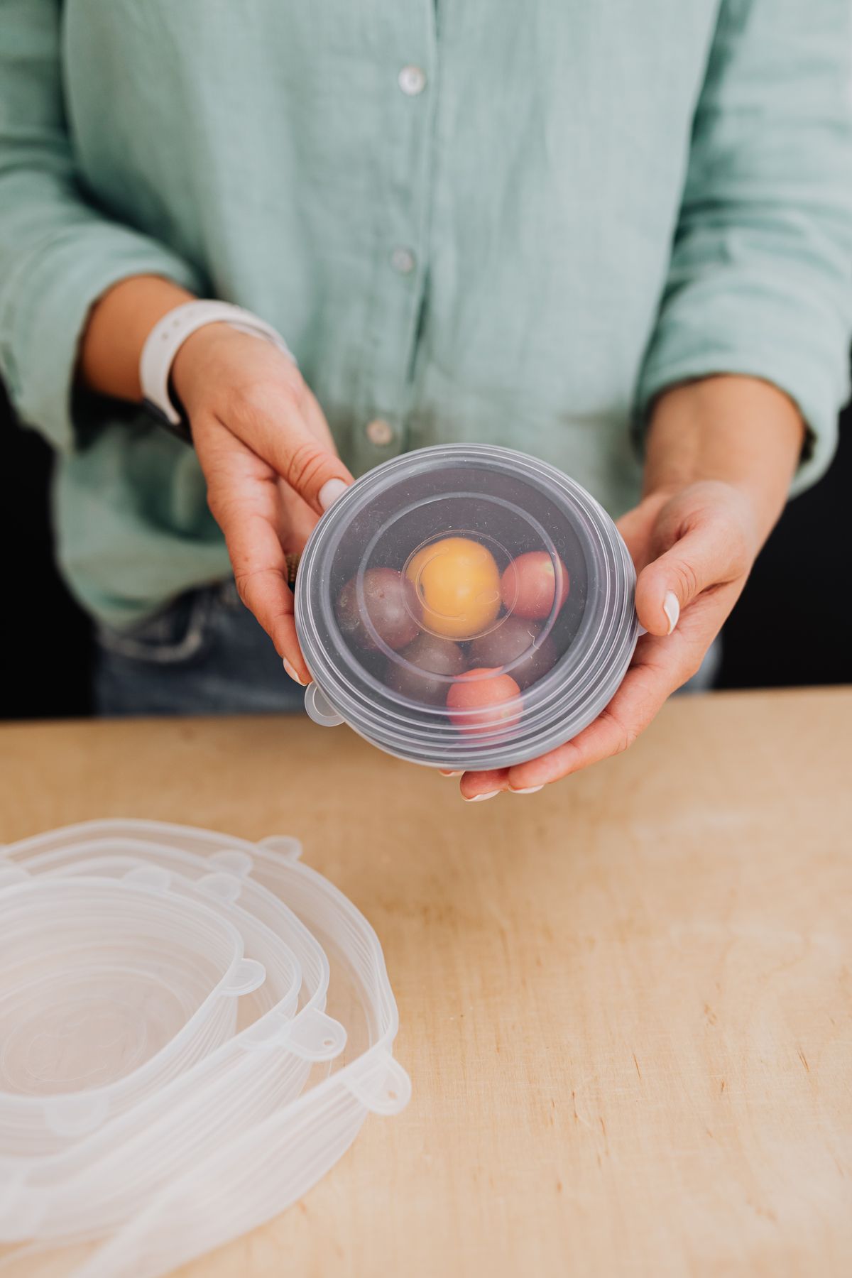 Reusable food cover over a bowl of fruit