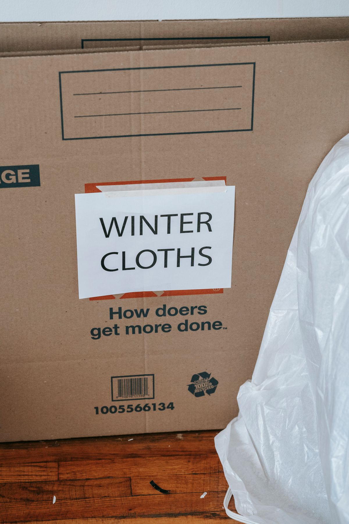A box labeled for winter clothes