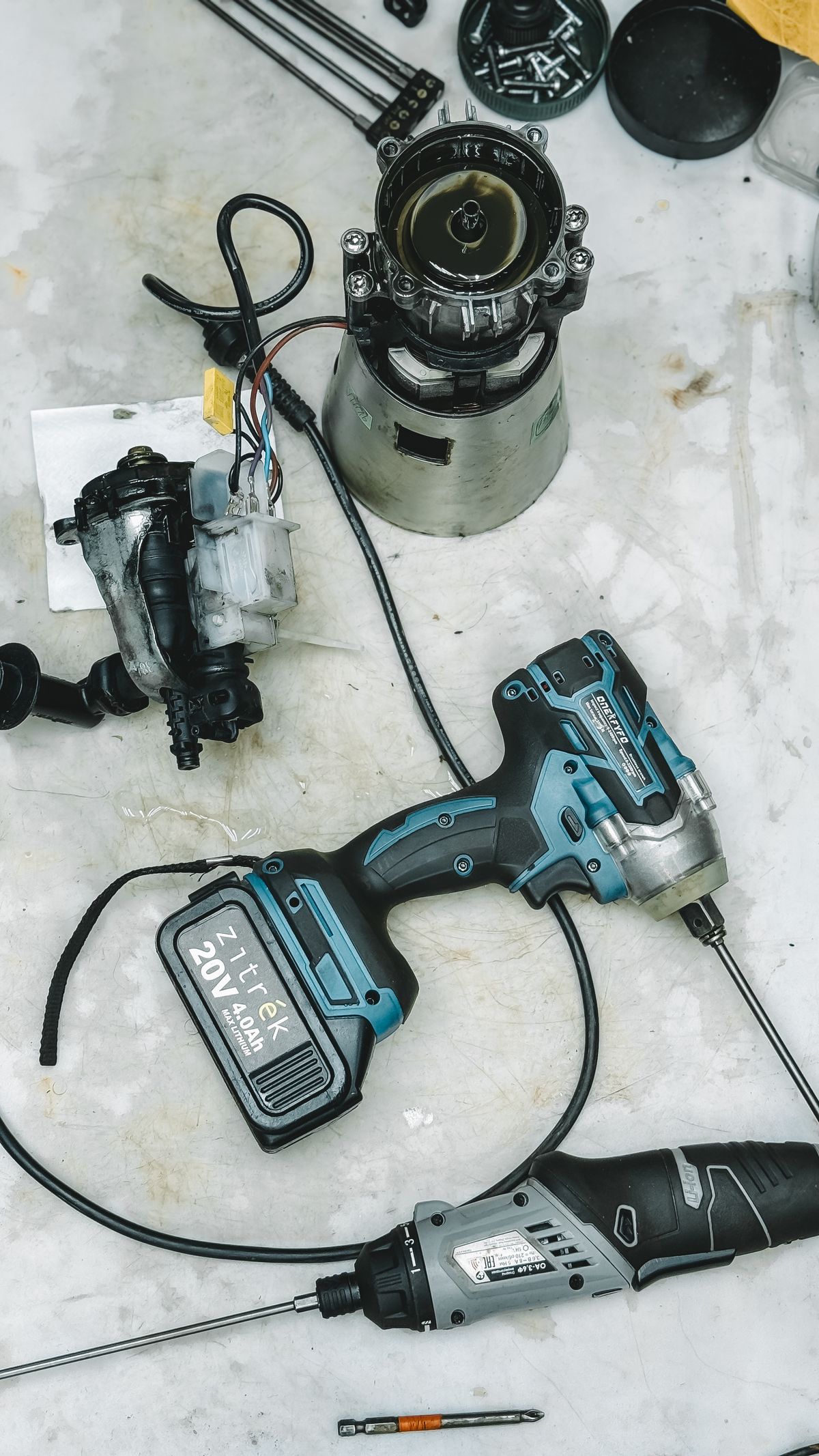 Tools and disassembled appliance parts