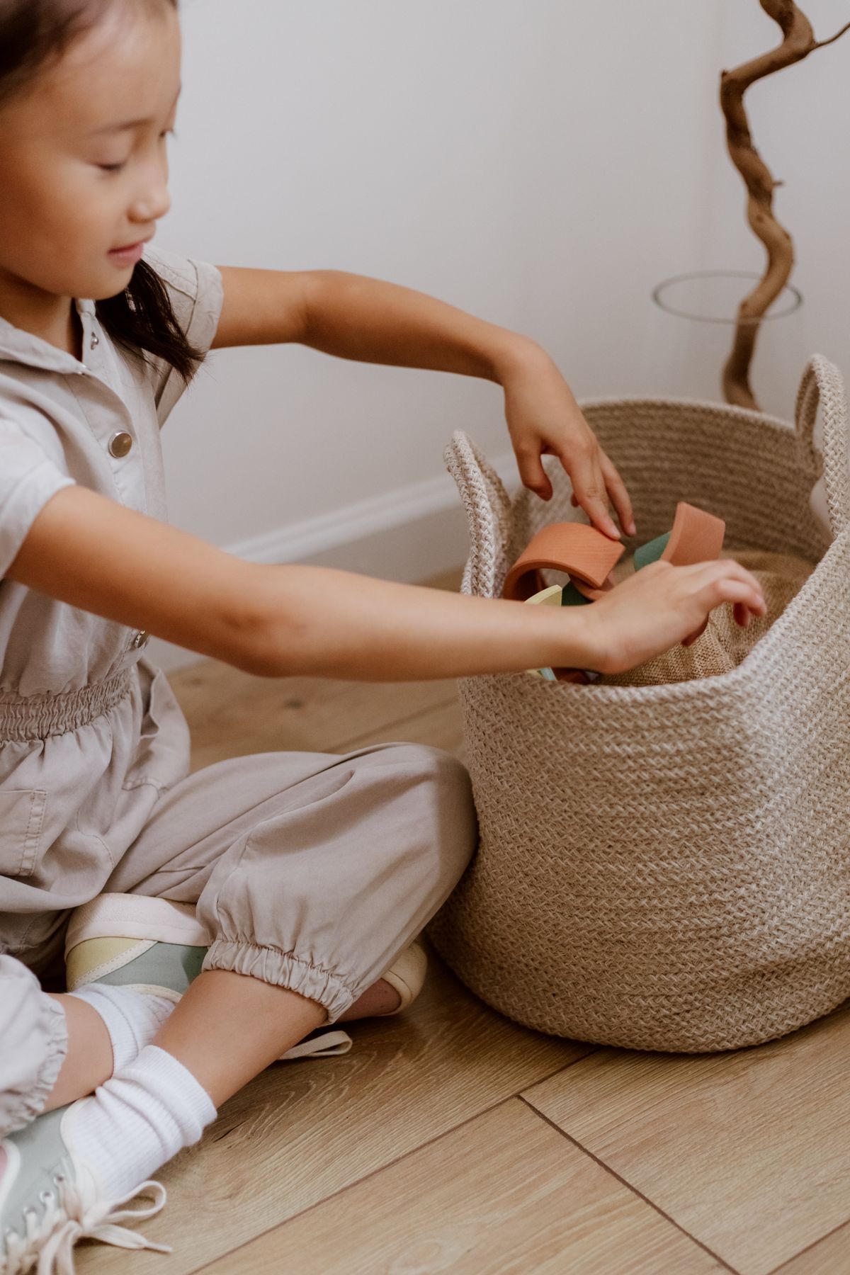 Putting toy pieces into a basket